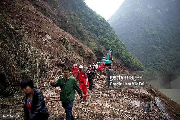 Rescue workers walk to BaoXing county, one of the hardest hit areas of the earthquake zone, on April 21, 2013 in China. A powerful earthquake struck...