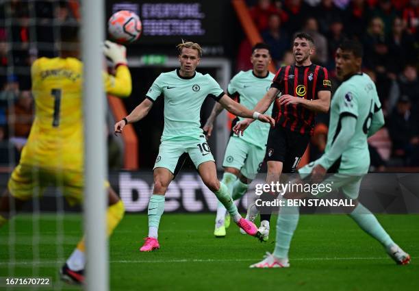 Chelsea's Spanish goalkeeper Robert Sanchez saves a shot frmo Chelsea's Ukrainian midfielder Mykhailo Mudryk during the English Premier League...