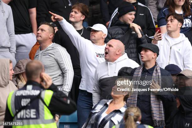 Millwall fans react to Leeds' taunting during the Sky Bet Championship match between Millwall and Leeds United at The Den on September 17, 2023 in...