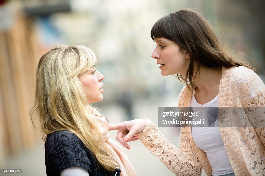 Two women arguing on the street