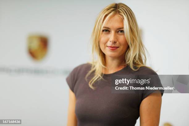 Tennis player Maria Sharapova poses for the media as she is unveiled as car manufacturer Porsche's new brand ambassador at the Porsche Museum on...