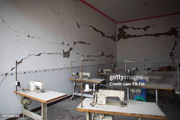 Cracks across the walls of a damaged clothing factory in BaoXing county, one of the hardest hit areas of the earthquake zone, on April 22, 2013 in...