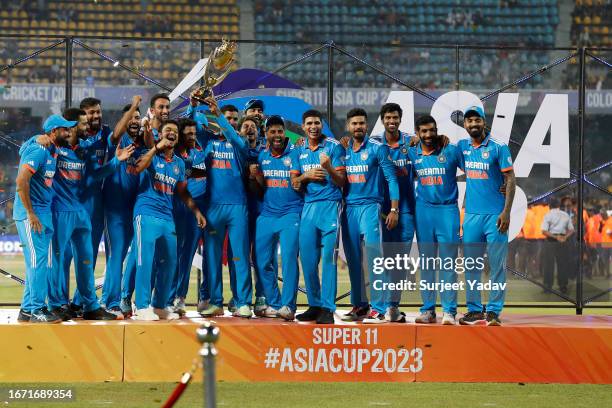 India's players celebrate with the trophy after winning the during the Asia Cup Final match between India and Sri Lanka at R. Premadasa Stadium on...