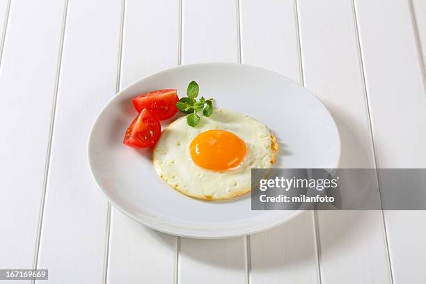 fried egg - portion stock pictures, royalty-free photos & images