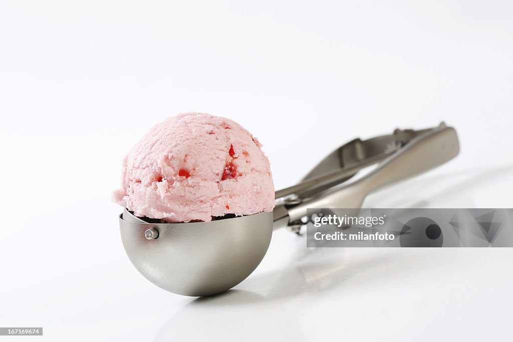 Strawberry ice cream on a scooper