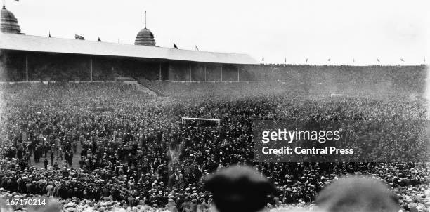 Crowds on the pitch during the FA Cup Final between Bolton Wanderers and West Ham United, 28th April 1923. This was the first FA Cup Final at Wembley...