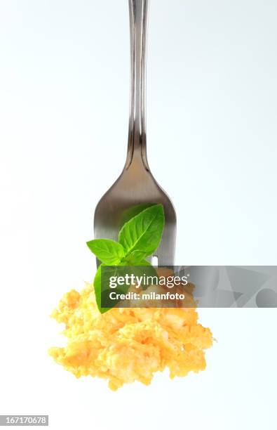 scrambled eggs on a fork - scrambled eggs stock pictures, royalty-free photos & images
