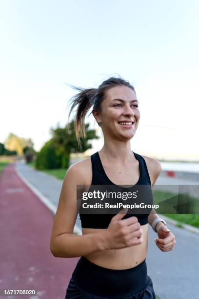 young caucasian woman going for a jog - athlete stock pictures, royalty-free photos & images