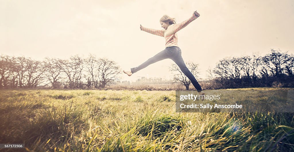Spring Leaping Young Girl Leaping Photo - Getty Images