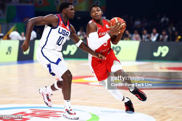 Barrett of Canada drives to the basket against Anthony Edwards of the United States in the first quarter during the FIBA Basketball World Cup 3rd...