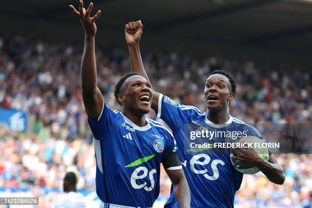 Strasbourg's South African forward Lebo Mothiba celebrates with Strasbourg's Dutch forward Emanuel Emegha after scoring a goal during the French L1...