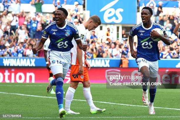 Strasbourg's South African forward Lebo Mothiba celebrates with Strasbourg's Dutch forward Emanuel Emegha after scoring a goal during the French L1...