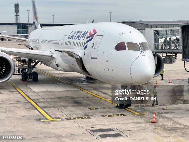 Passengers disembark from a Latam Airlines Boeing 787 Dreamliner at Charles de Gaulle International Airport in Paris on September 17, 2023.