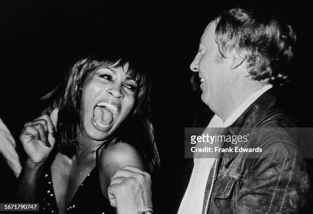 American singer and actress Tina Turner and Australian-born British music impresario Robert Stigwood attend the wrap party for the 'Sgt Pepper's...