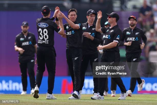 Trent Boult of New Zealand celebrates after taking the wicket of Joe Root of England during the 2nd Metro Bank One Day International match between...