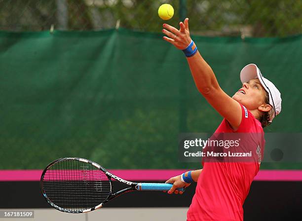 Romina Oprandi of Switzerland serves against Samantha Stosur of Australia during day three of the Fed Cup World Group Play-Offs between Switzerland...