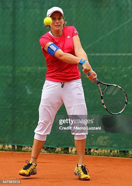 Romina Oprandi of Switzerland plays a backhand against Samantha Stosur of Australia during day three of the Fed Cup World Group Play-Offs between...