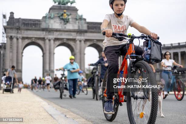 Boy rides a bike during the Car Free Sunday in the Brussels Capital region, on September 17, 2023. In several cities and towns across Belgium a...