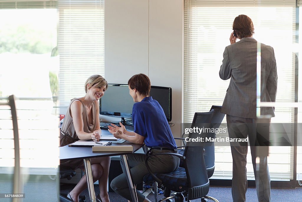 Business people meeting at desk in office