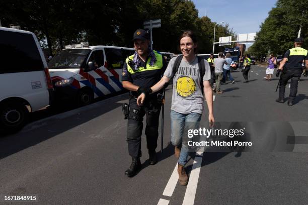 Climate activist is removed from the A12 motorway as it is blocked for the second day in a row in protest against the government’s support for the...