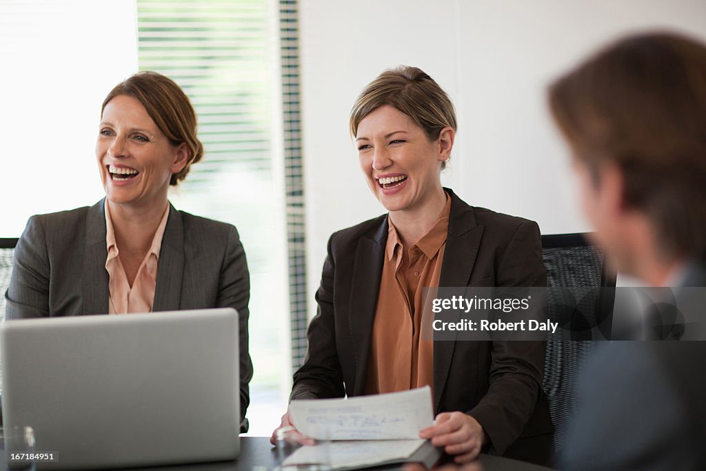 Business people meeting at table in conference room