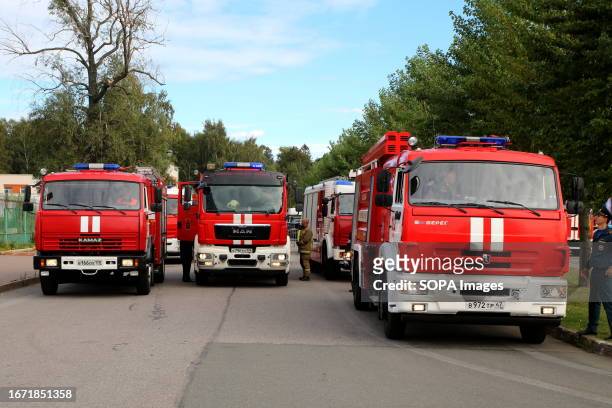 Fire trucks lined up in a row near Gazprom Arena in Saint Petersburg, in Primorsky Victory Park at competitions, high-speed maneuvering on fire...