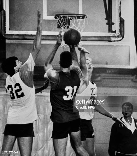 American basketball player Kevin McHale, Celtics power forward, American basketball player Fred Roberts, Celtics power forward, and American...