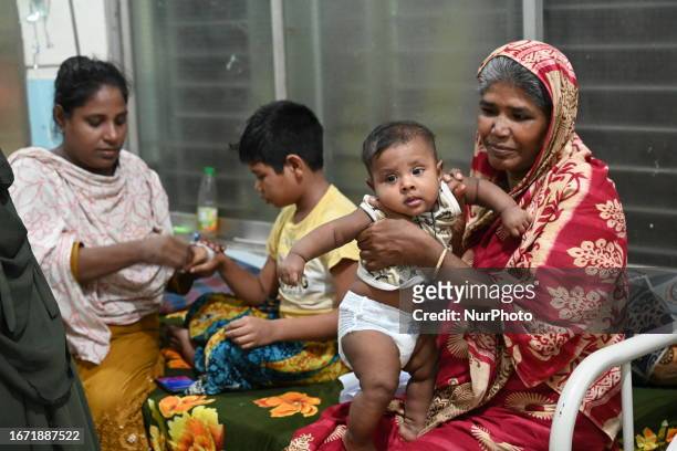 Patients suffering from dengue fever are being treated inside the Mugdha General Hospital's admission section in Dhaka, Bangladesh on September 17,...