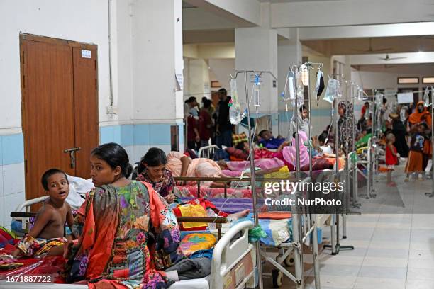 Patients suffering from dengue fever are being treated inside the Mugdha General Hospital's admission section in Dhaka, Bangladesh on September 17,...