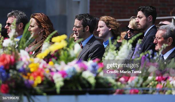 People wait on line to attend the funeral for 29-year-old Krystle Campbell who was one of three people killed in the Boston Marathon bombings on...