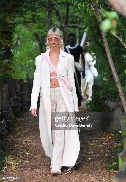 Mia Regan walks the runway at the Holzweiler show during London Fashion Week September 2023 at Camley Street Natural Park on September 17, 2023 in...