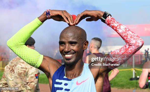 Sir Mo Farah of Great Britain pictured doing the 'mobot' after finishing in fourth place in the Elite Men race in his final race during the AJ Bell...