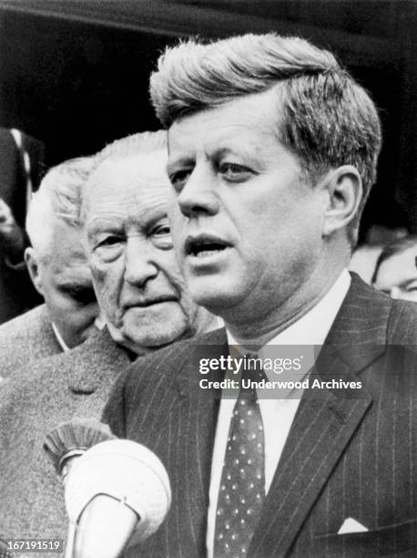 President Kennedy with West German Chancellor Konrad Adenauer declares that they have renewed their pledge to 'preserve the freedom of the people of...