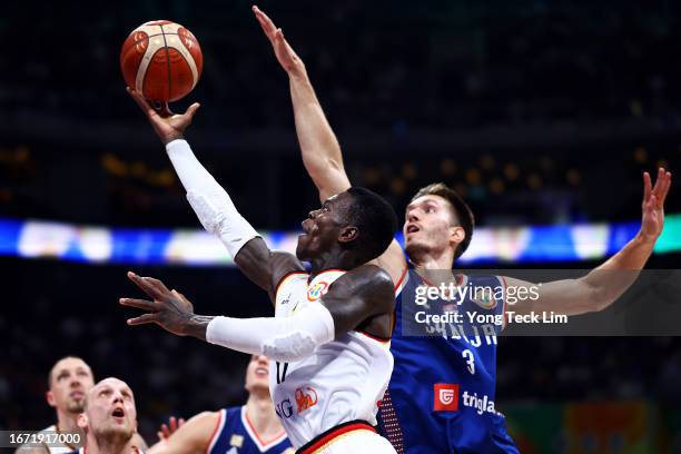 Dennis Schroder of Germany drives to the basket against Filip Petrusev of Serbia in the fourth quarter during the FIBA Basketball World Cup Final at...