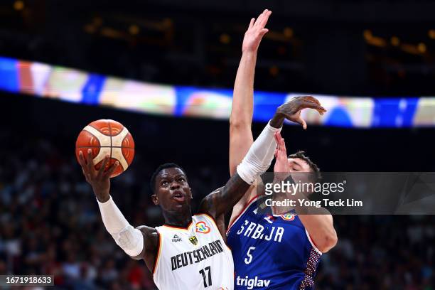 Dennis Schroder of Germany drives to the basket against Nikola Jovic of Serbia in the fourth quarter during the FIBA Basketball World Cup Final at...