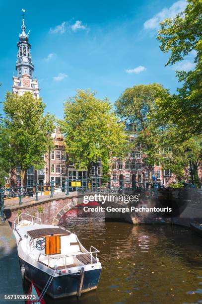 boat and bridge in amsterdam, holland - amsterdam spring stock pictures, royalty-free photos & images