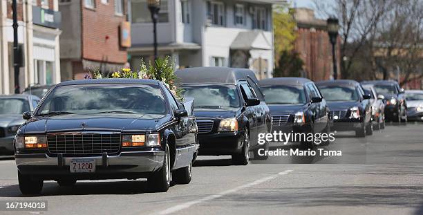 The funeral procession passes through town for 29-year-old Krystle Campbell, who was one of three people killed in the Boston Marathon bombings, on...