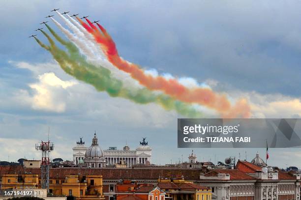 The Frecce Tricolori, aerobatic demonstration team of the Italian Aeronautica Militare, flies over the Altare della Patria in Rome on April 22 as the...