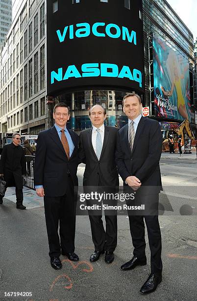 Director of NASDAQ Robert Phillips, Viacom President & CEO Philippe Dauman and NASDAQ EVP Bruce Aust ring the NASDAQ Stock Market opening bell in...