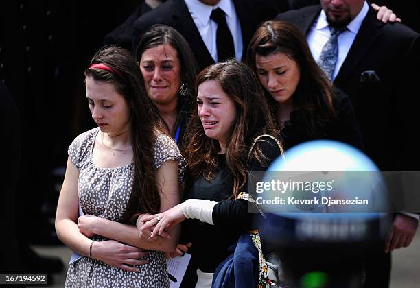 Mourners walk out of St. Joseph Catholic Church after the funeral service for Krystle Campbell, a victim of the Boston Marathon bombing, on April 22,...