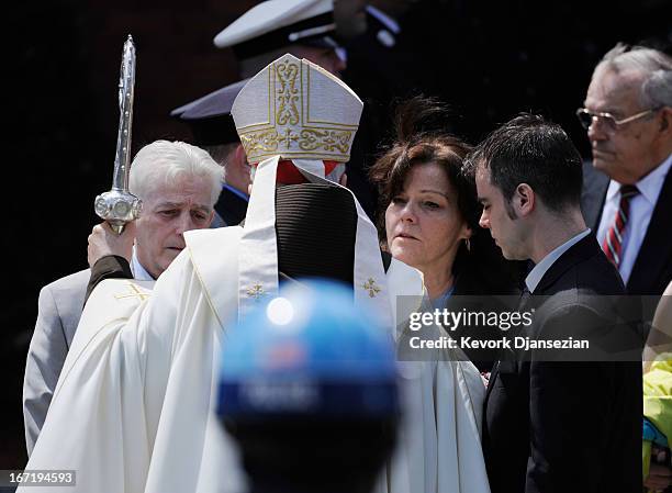 Patty Cambell mother of Krystle Campbell, a victim of the Boston Marathon bombing, and brother Billy Campbell talk with Cardinal Sean O'Malley at St....