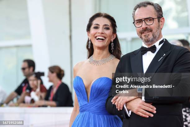 Cterina Murino and Edouard Rigaud attend a red carpet ahead of the closing ceremony at the 80th Venice International Film Festival on September 09,...