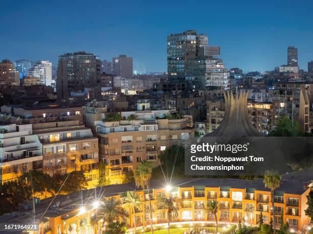 high angle view of downtown cairo cityscape - zamalek - cairo - egypt - at night - road to war in middle east and north africa stock-fotos und bilder