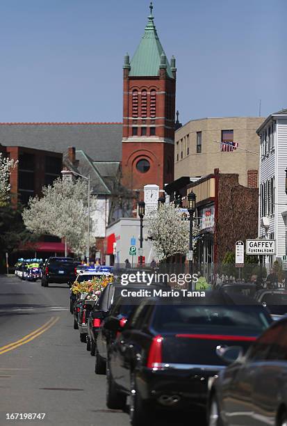 The funeral procession passes through town for 29-year-old Krystle Campbell, who was one of three people killed in the Boston Marathon bombings, on...