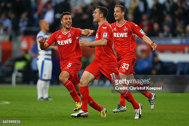 Thomas Broeker of Koeln celebrates the first goal with Dominic Maroh and Matthias Lehmann of Koeln during the Second Bundesliga match between MSV...