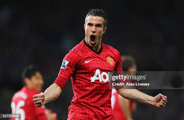 Robin van Persie of Manchester United celebrates scoring the opening goal during the Barclays Premier League match between Manchester United and...