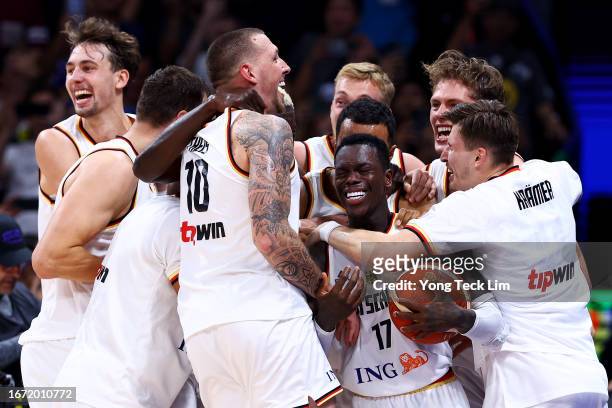 Dennis Schroder of Germany celebrates with teammates after the FIBA Basketball World Cup Final victory over Serbia at Mall of Asia Arena on September...
