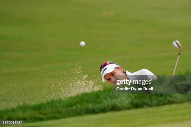 Lexi Thompson of the United States plays a shot from a bunker on the fourth hole during the final round of the Kroger Queen City Championship...