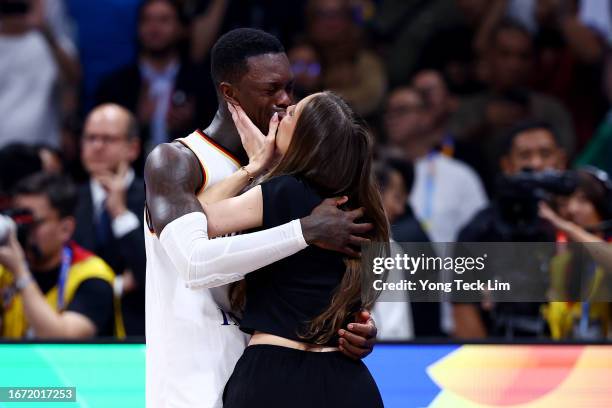 Dennis Schroder of Germany kisses his wife Ellen Ziolo after the FIBA Basketball World Cup Final victory over Serbia at Mall of Asia Arena on...