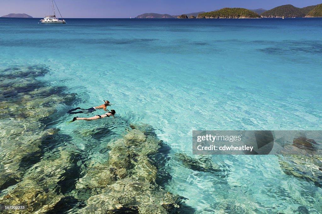 Honeymoon couple snorkeling in the Caribbean waters